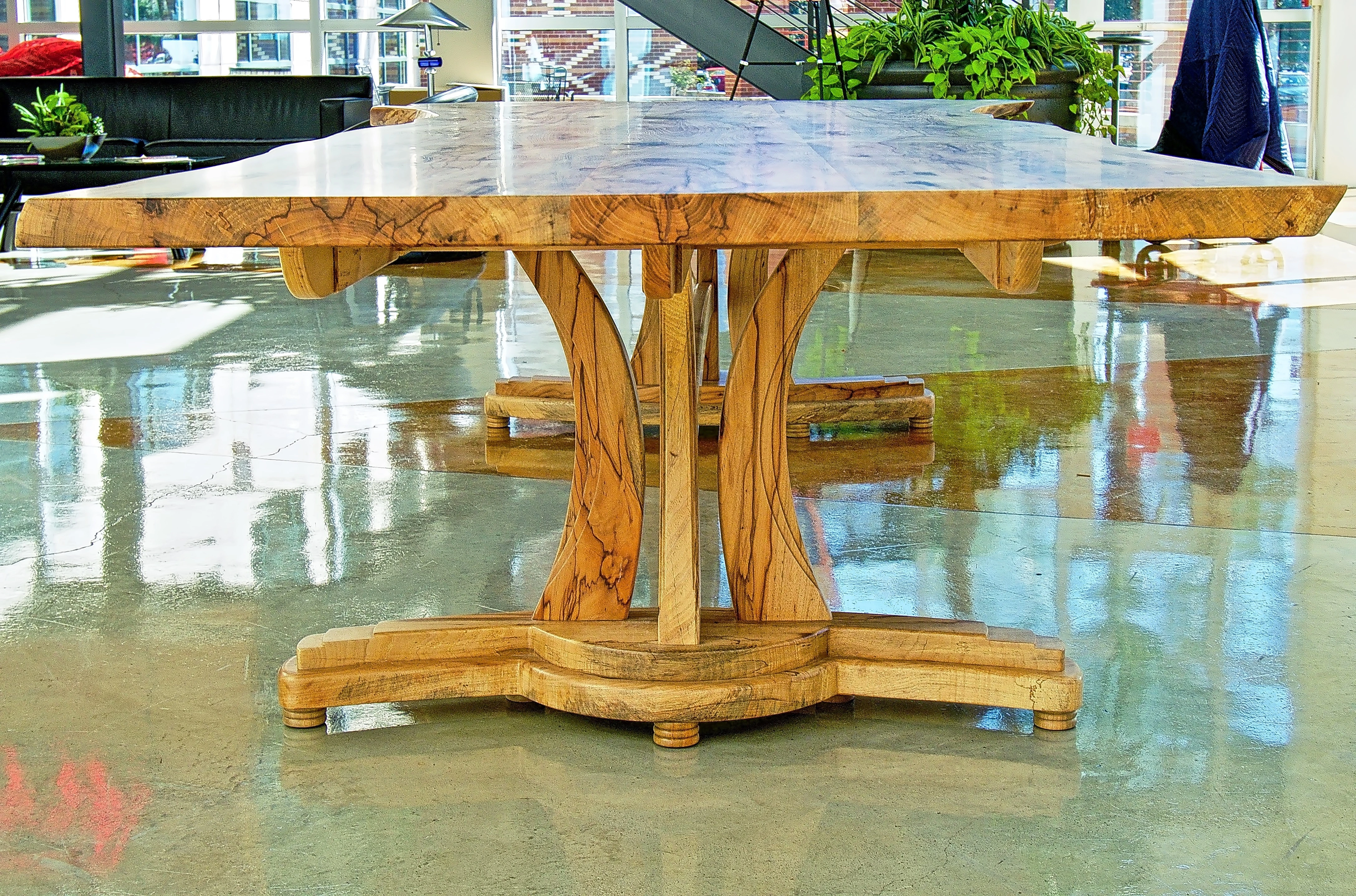 Live edge Texas pecan table with sculptural base.